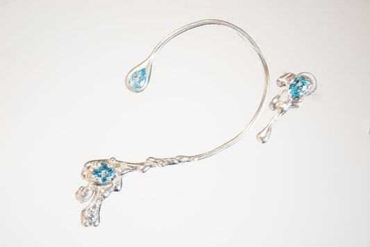 Ánima. Arete y ear climber con topacio azul