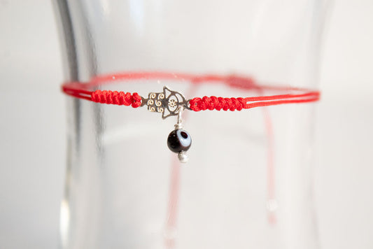 Talismán. Pulsera con dije de plata .925
