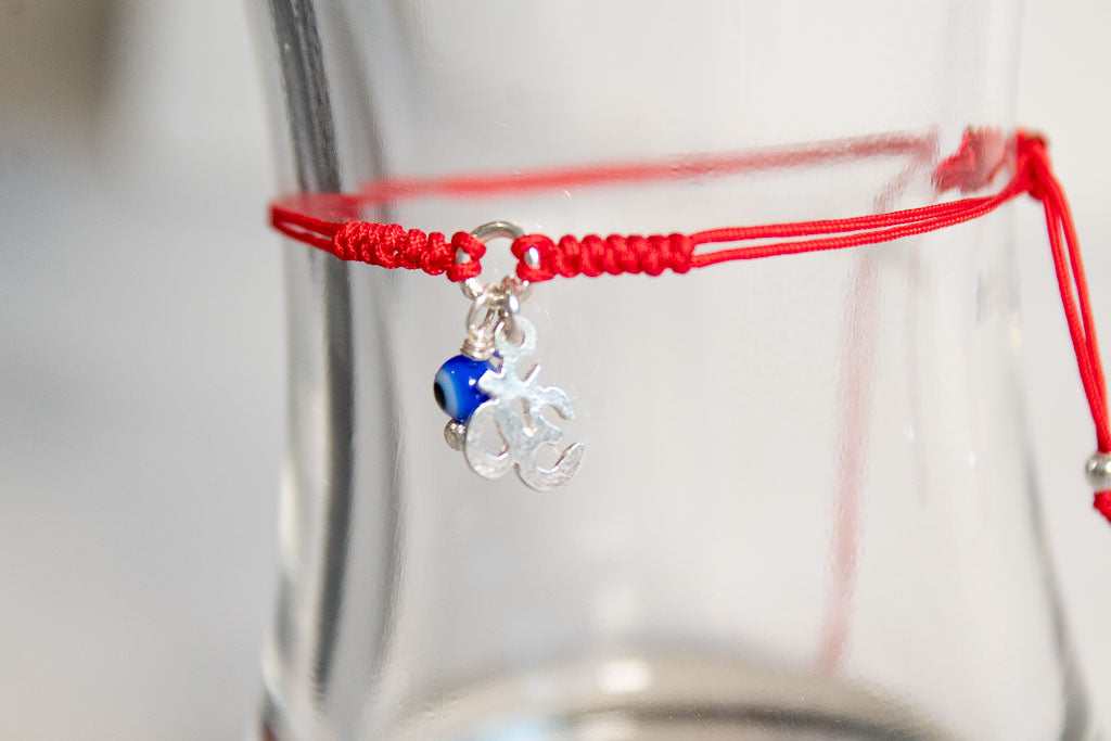 Talismán. Pulsera con dije de plata .925