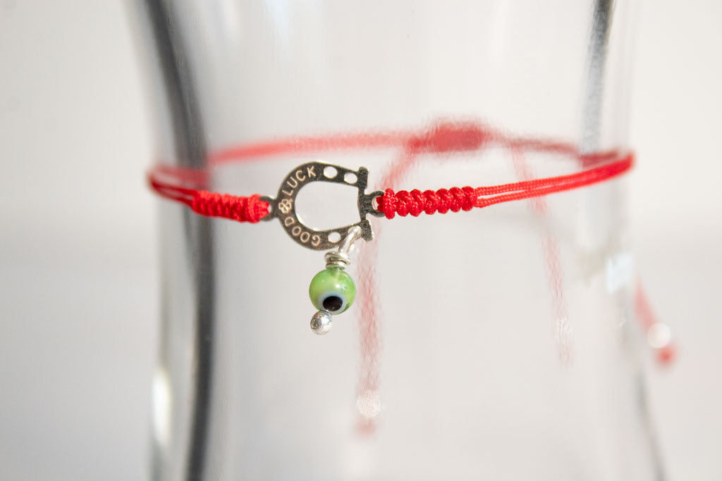 Talismán. Pulsera con dije de plata .925