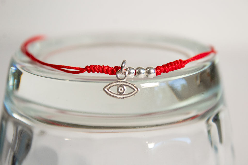 Talismán. Pulsera con dije de plata .925