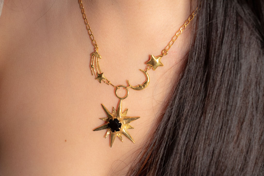 Ecos. Collar con astros y ónix