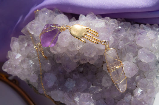 The protector. Hand and amethyst necklace