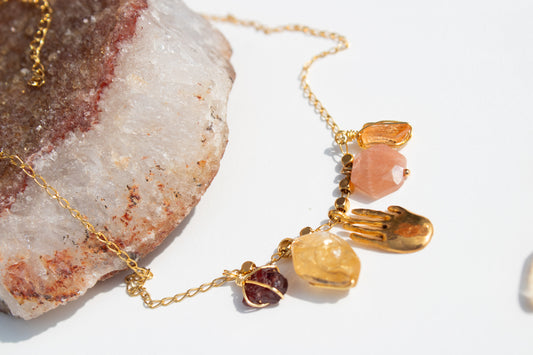 Apotropaic. Necklace with garnet, topaz, citrine and sun stone