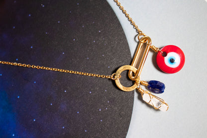 Claridad. Collar con danburita. sodalita y ojo rojo de murano