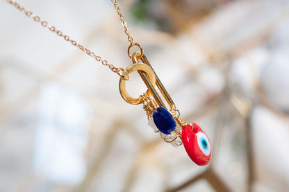 Claridad. Collar con danburita. sodalita y ojo rojo de murano