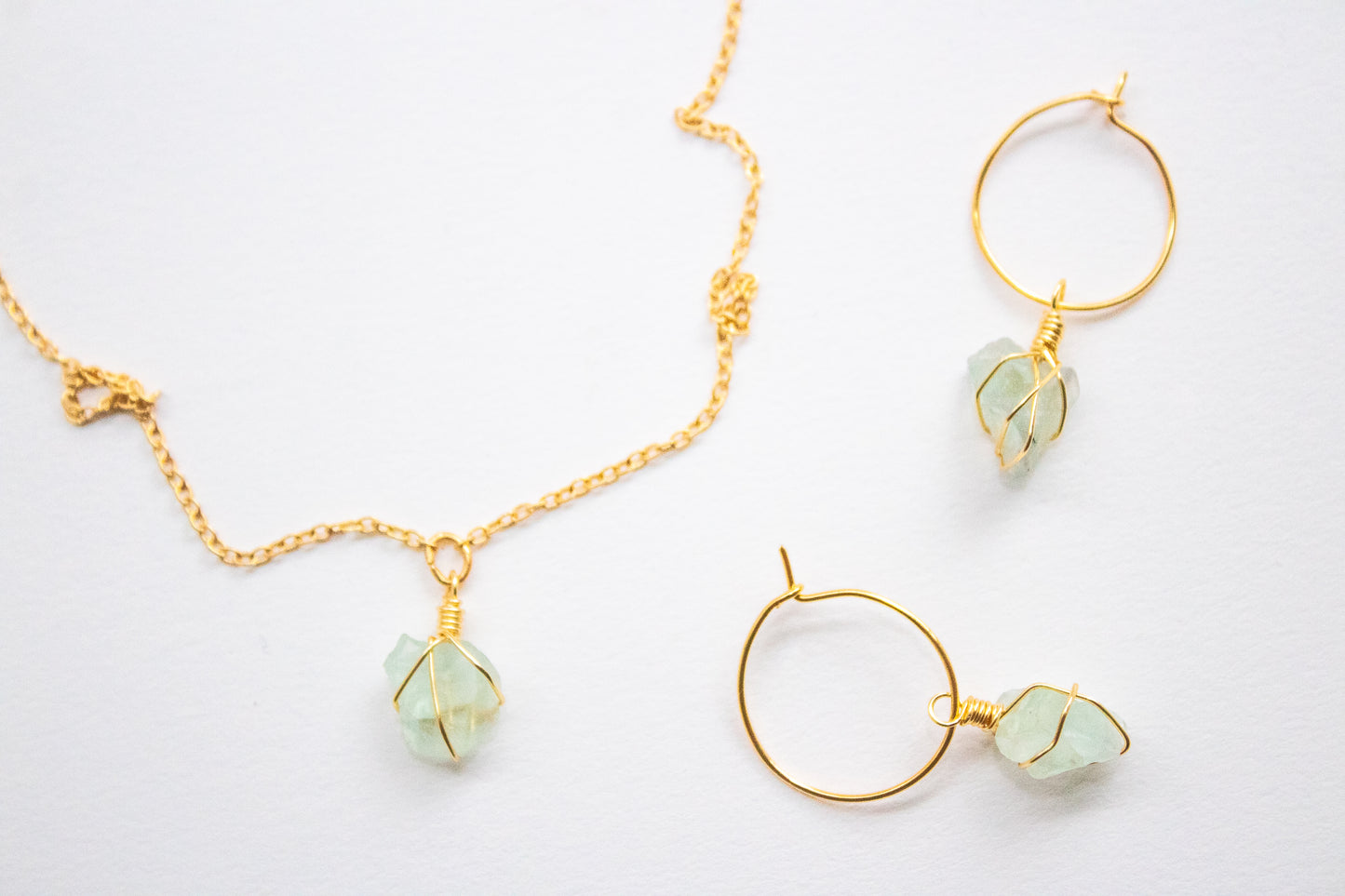 Yaax. Minimalist hoop earrings with green rustic fluorite