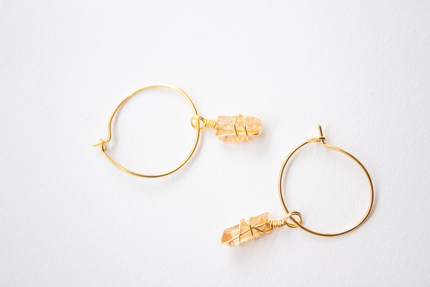 Yaluk. Minimalist hoop earrings with yellow topaz