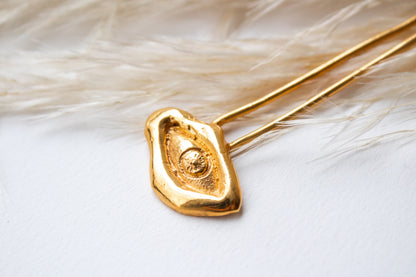 Náay. Pasador de ojo