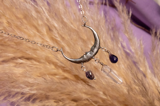 Like. Half moon necklace with sapphire, white quartz and pearl