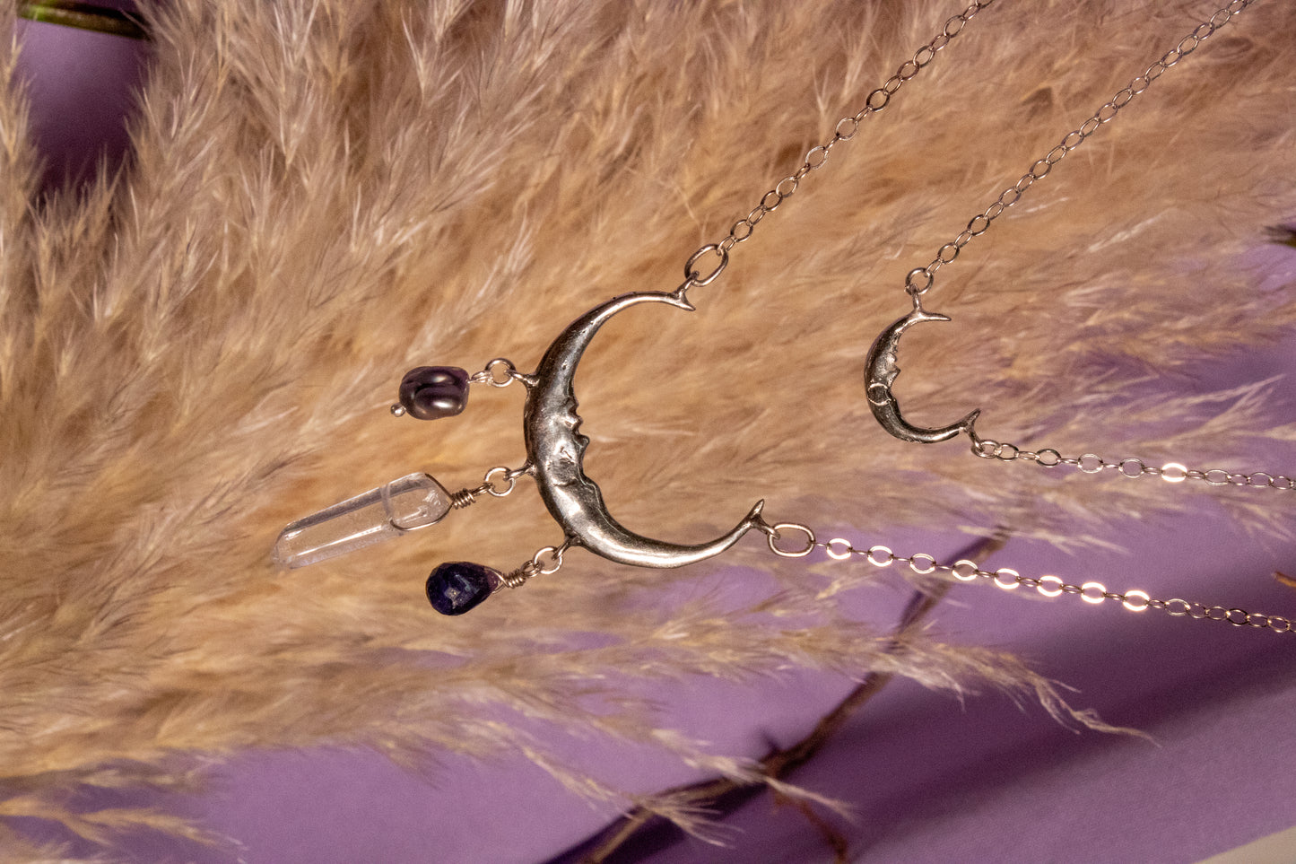 Like. Half moon necklace with sapphire, white quartz and pearl