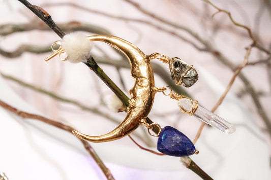 Yaxkin. Moon-shaped hoop earrings with lapis lazuli, white quartz and pyrite