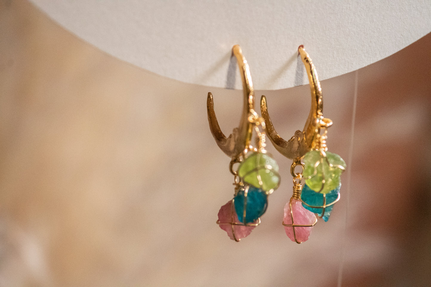 Cheel. Moon hoop earrings with peridot, apatite and pink tourmaliine