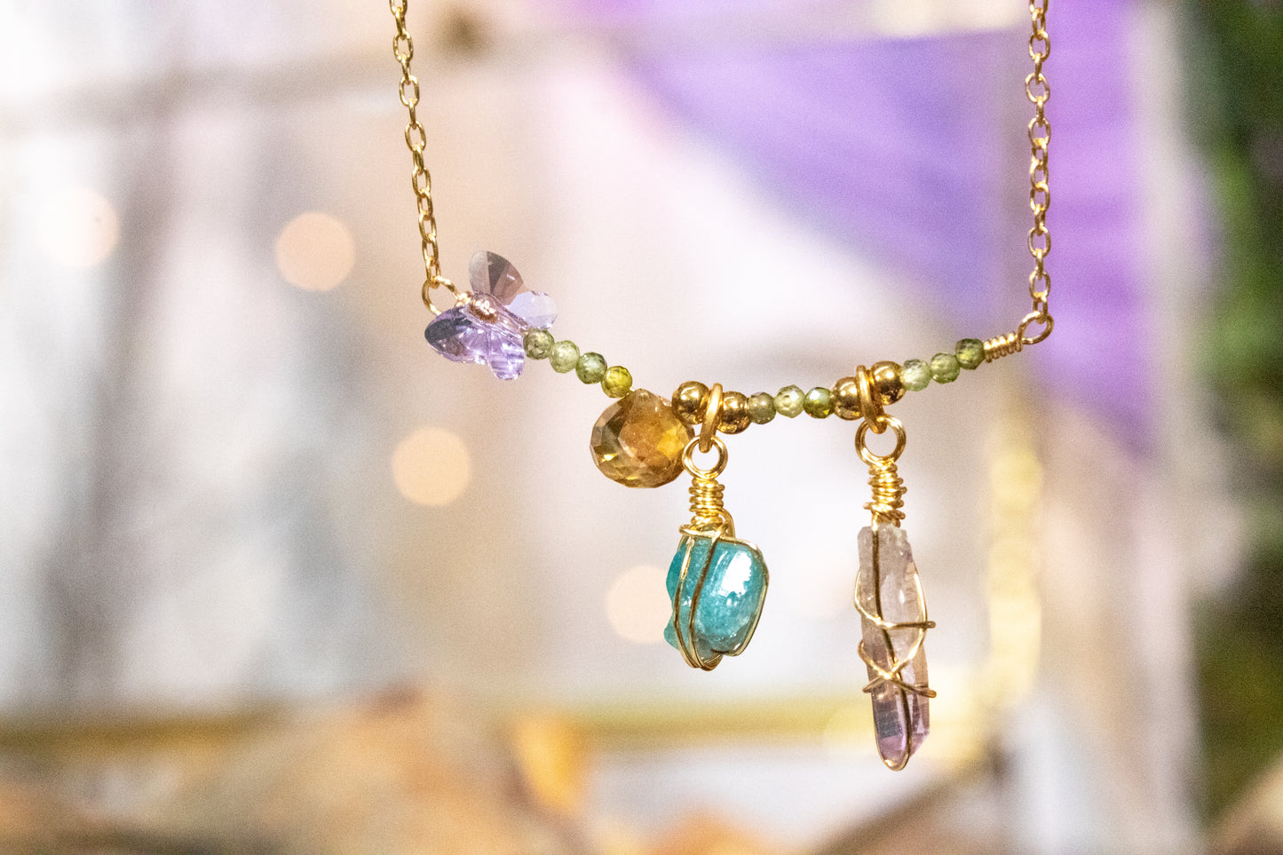 Yatzil. Necklace with zirconia, amethyst, apatite, citrine and Swarovski butterfly