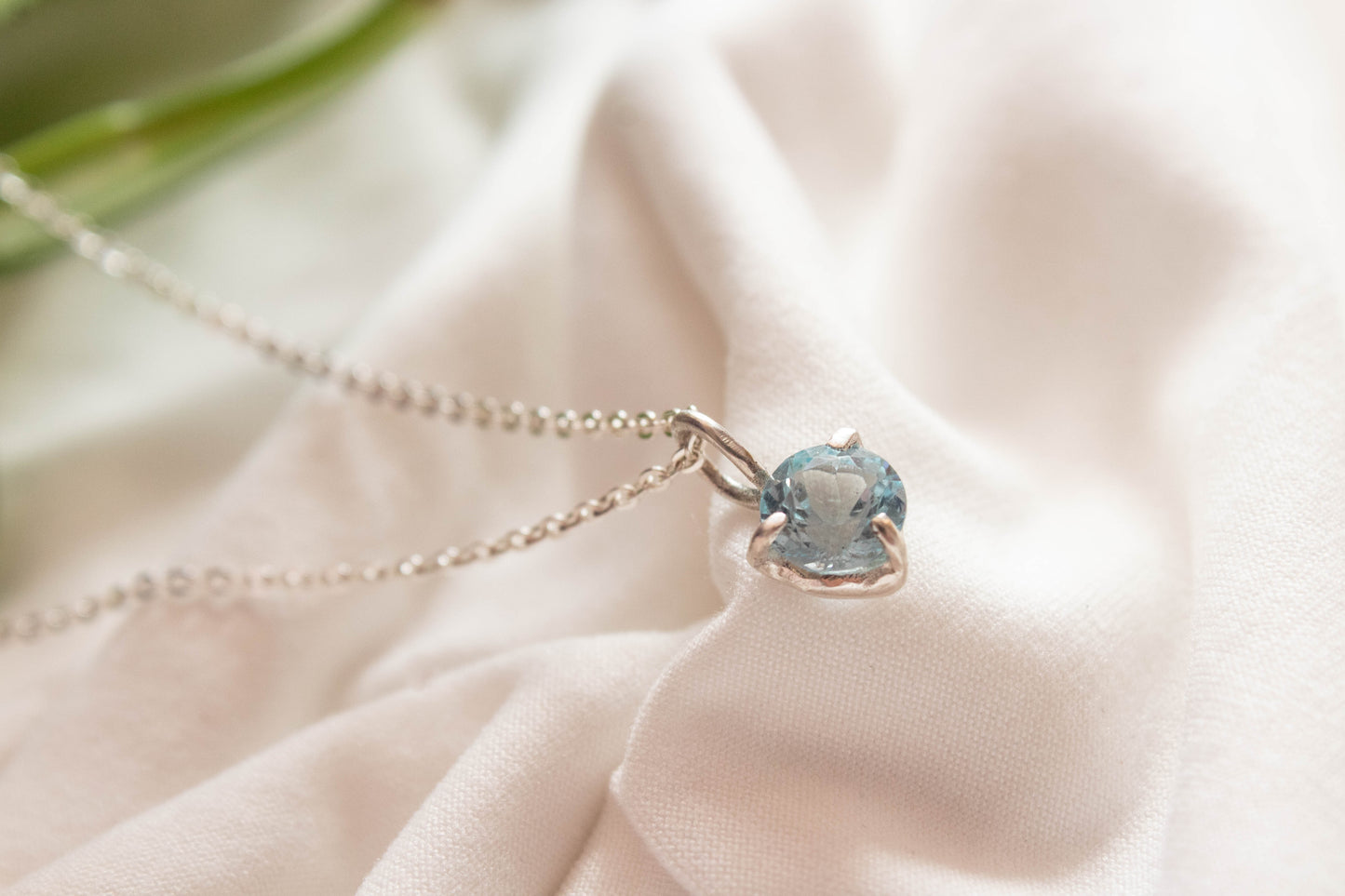 Nemesis. Silver necklace with London blue topaz