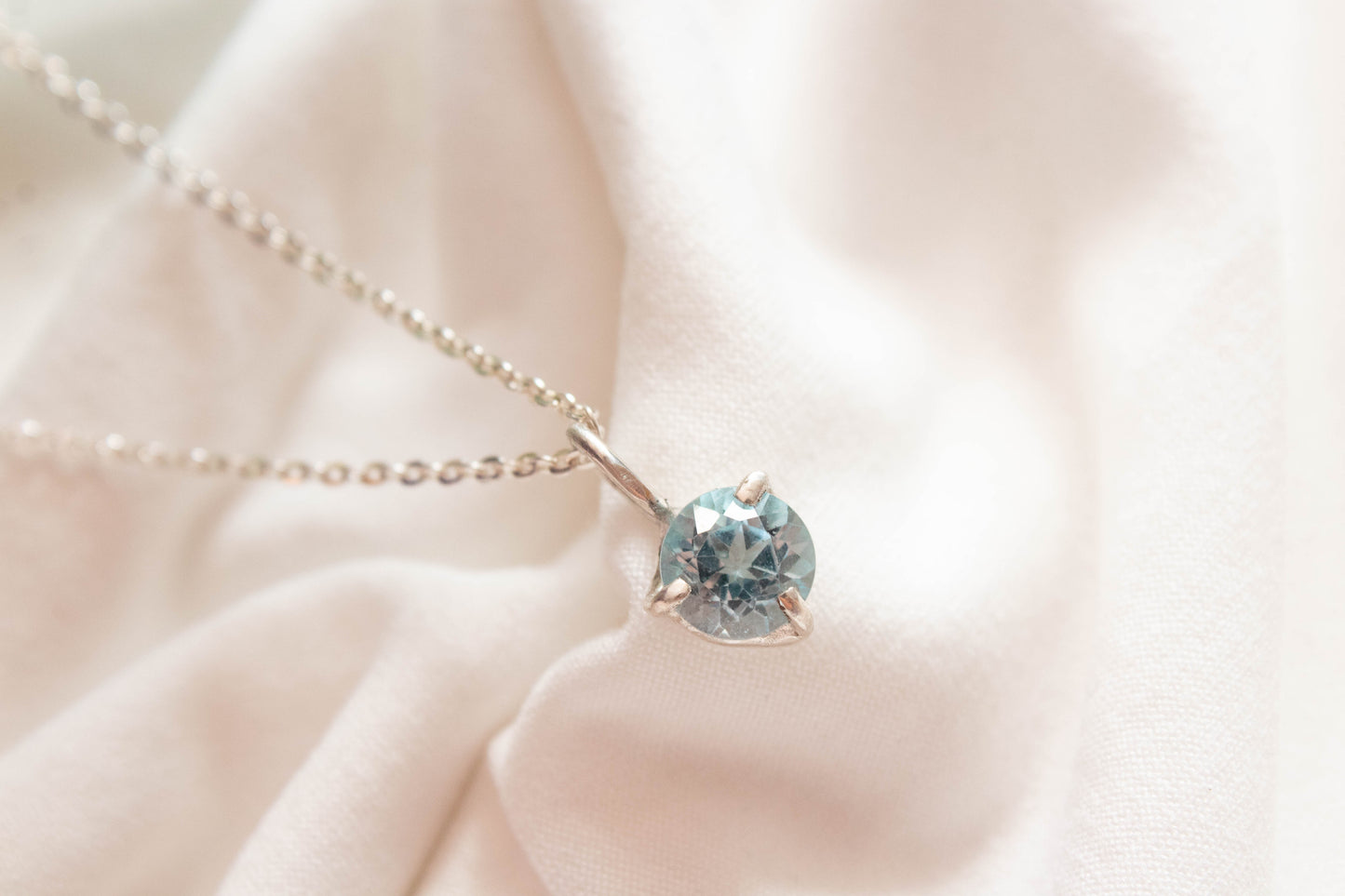 Nemesis. Silver necklace with London blue topaz