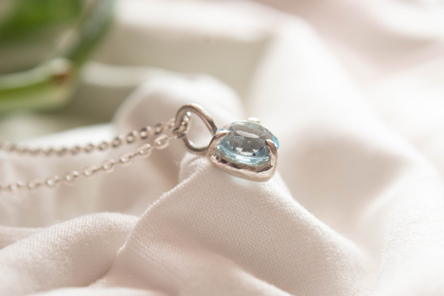 Nemesis. Silver necklace with London blue topaz