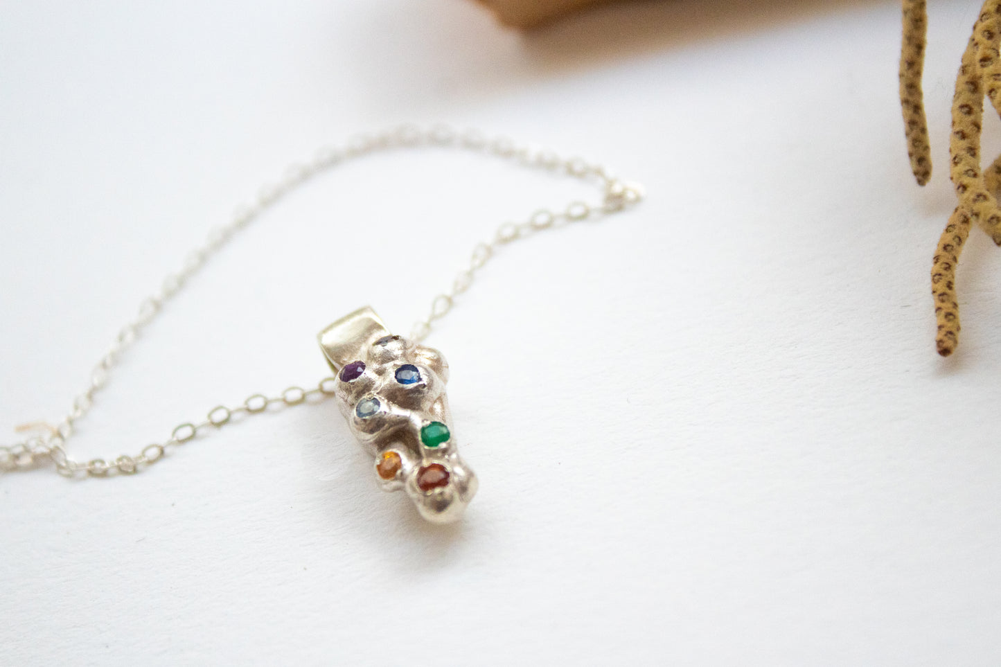 The Pee. Silver necklace with gems 
