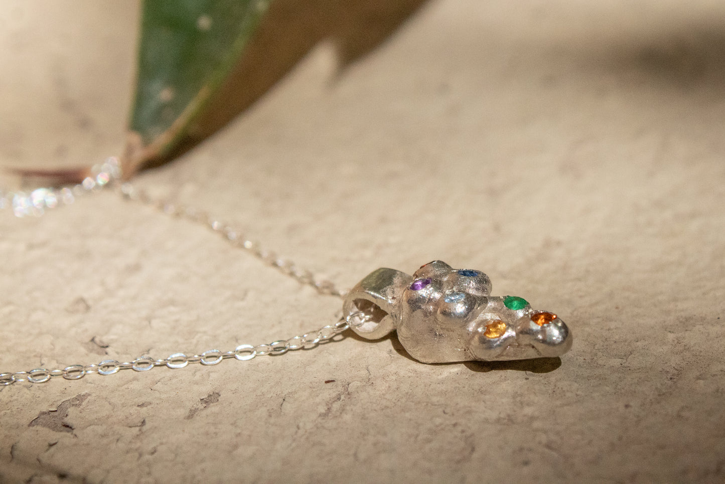 The Pee. Silver necklace with gems 